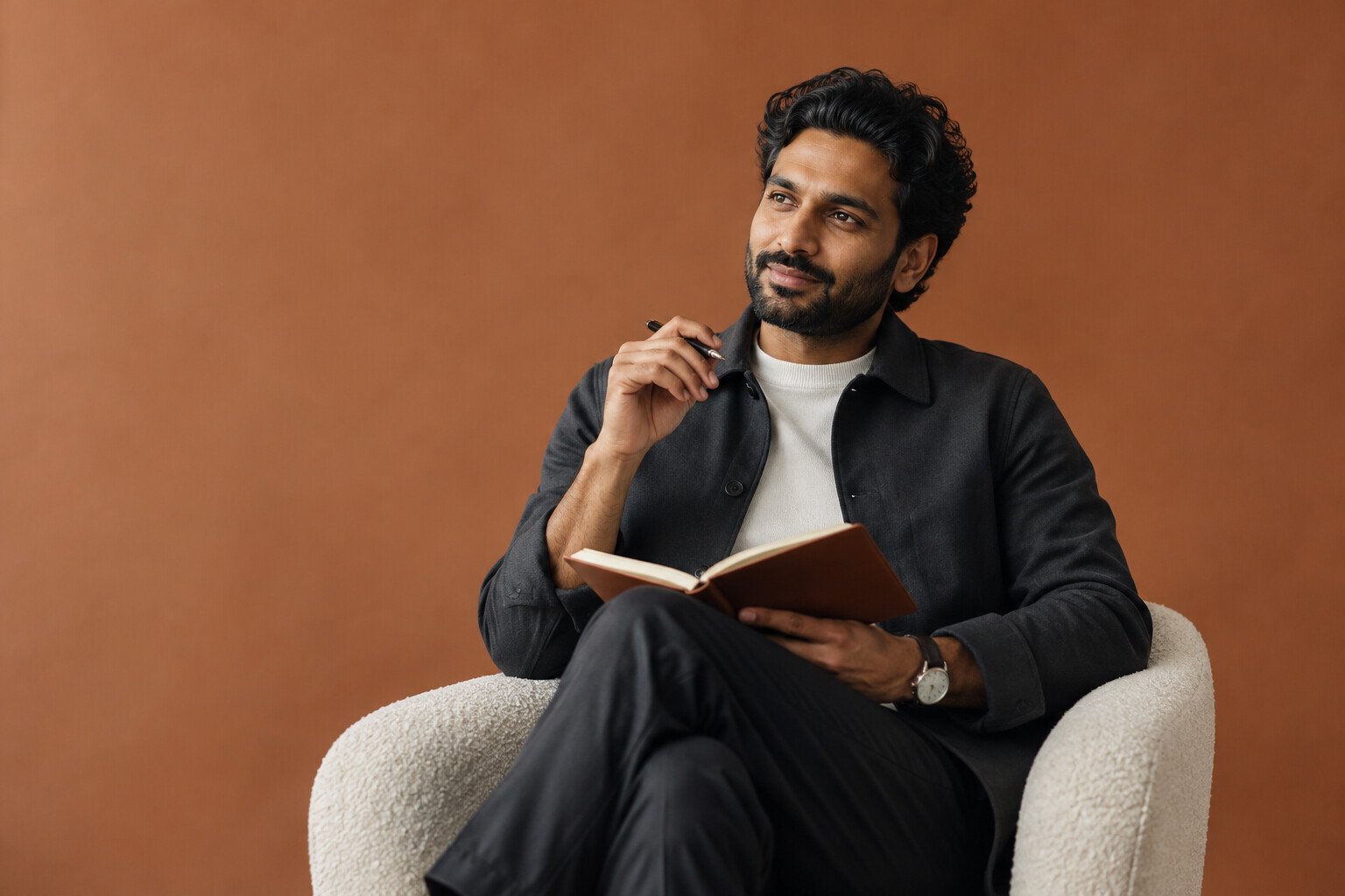 Illustrative studio photograph of a professional reflecting against a clay backdrop